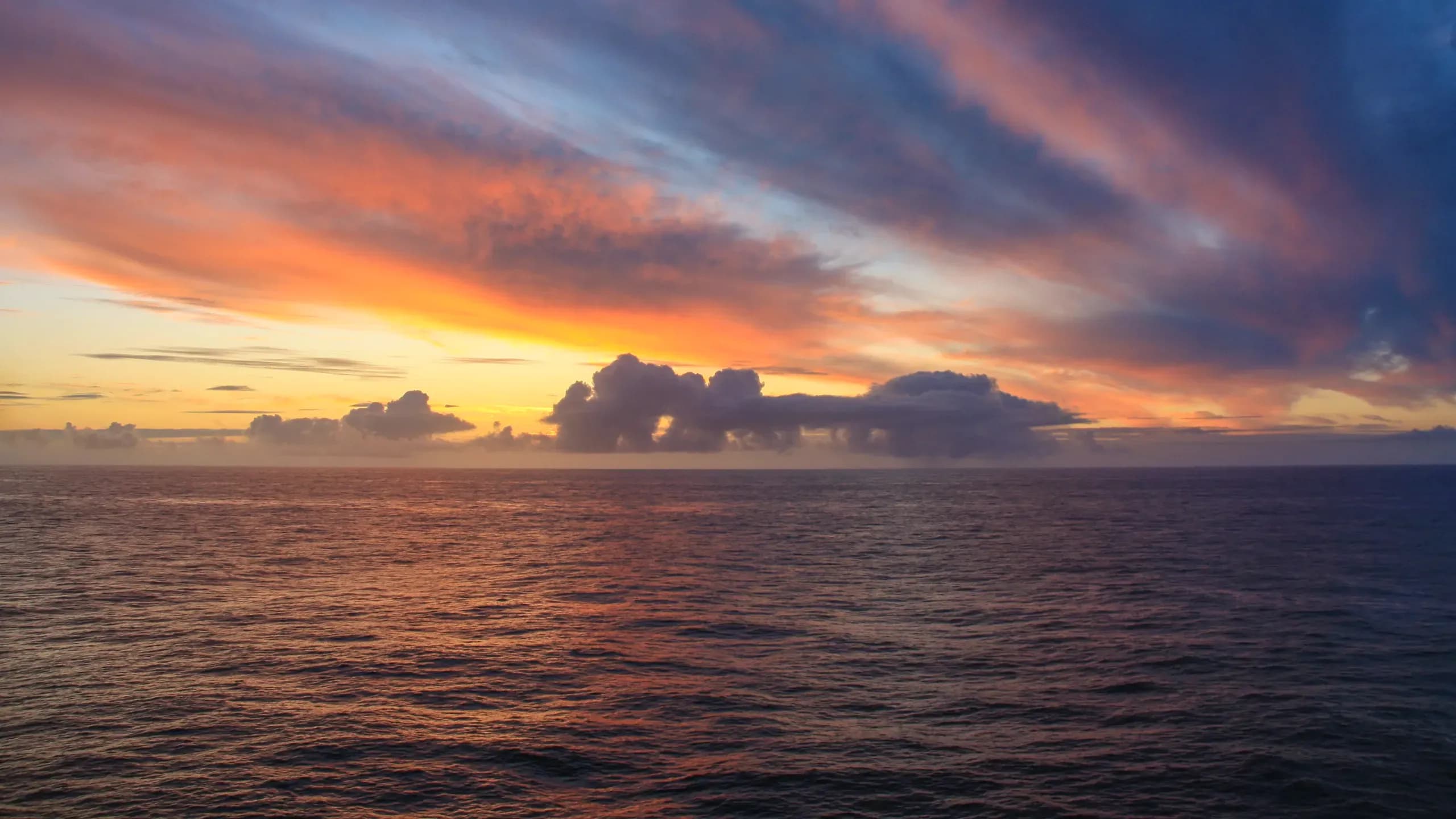 Breathtaking panoramic sunset view over the Pacific Ocean and Banderas Bay from Amapas 314 featuring vibrant orange, pink, and purple sky with soft cloud formations