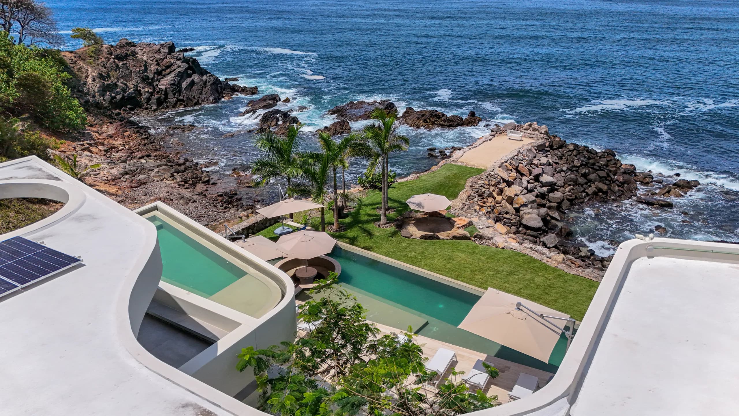 Open-concept living spaces designed to connect seamlessly with the terrace, ocean views, and surrounding natural landscape.