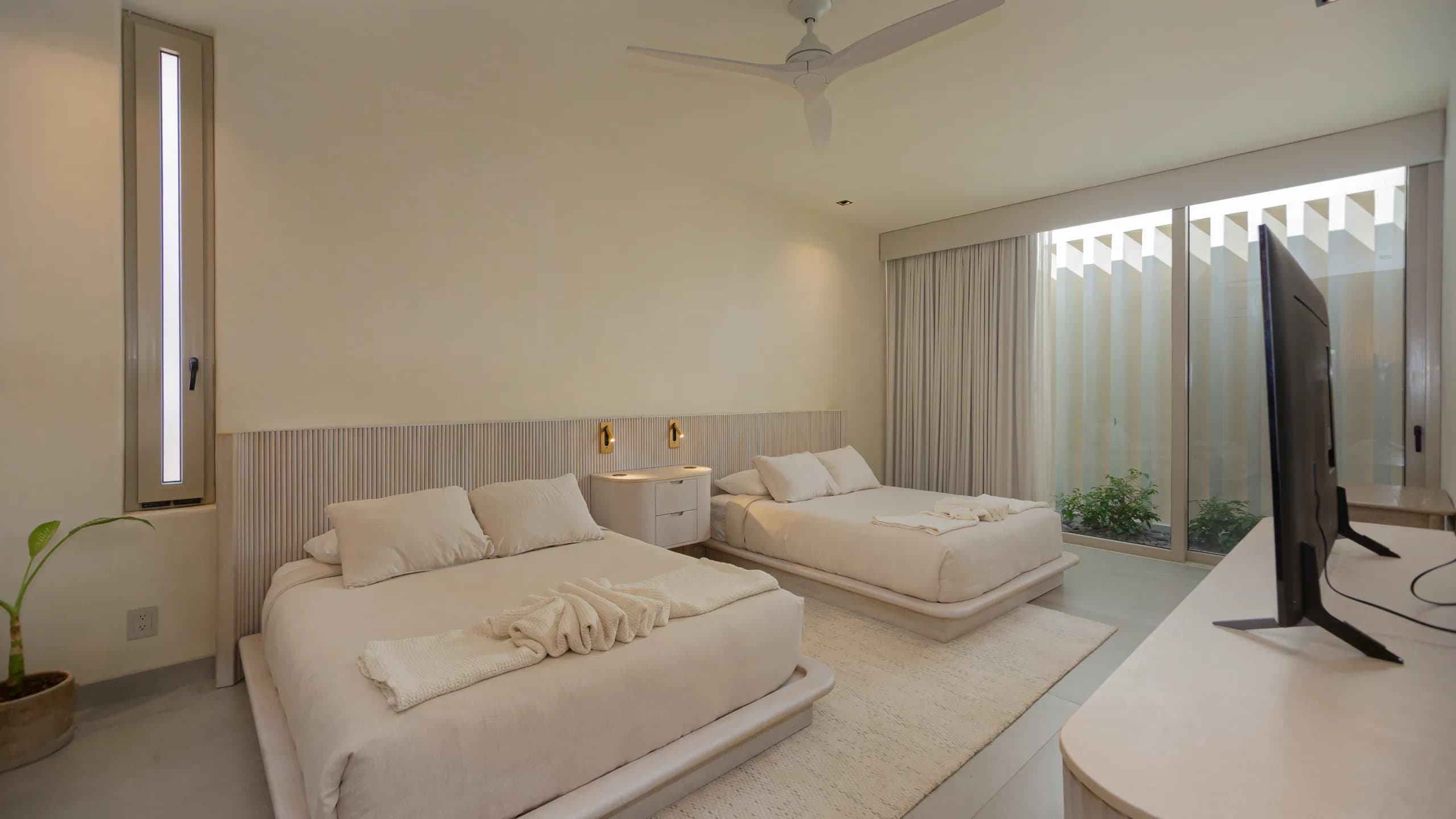 Thoughtfully designed guest accommodations offering natural light, privacy, and a refined minimalist aesthetic.